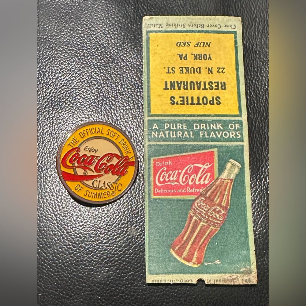 Coca-Cola pin and vintage match book